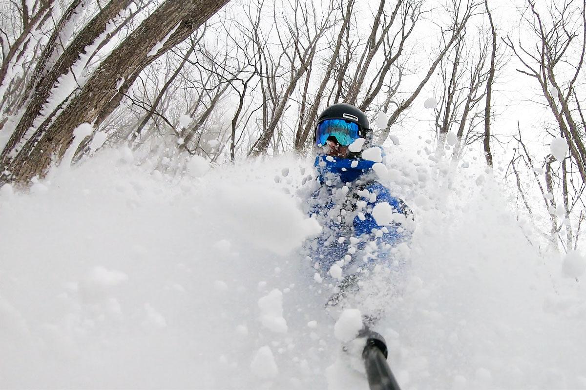 Riding powder stashes at Madarao Mountain in the trees. Japow is epic.
